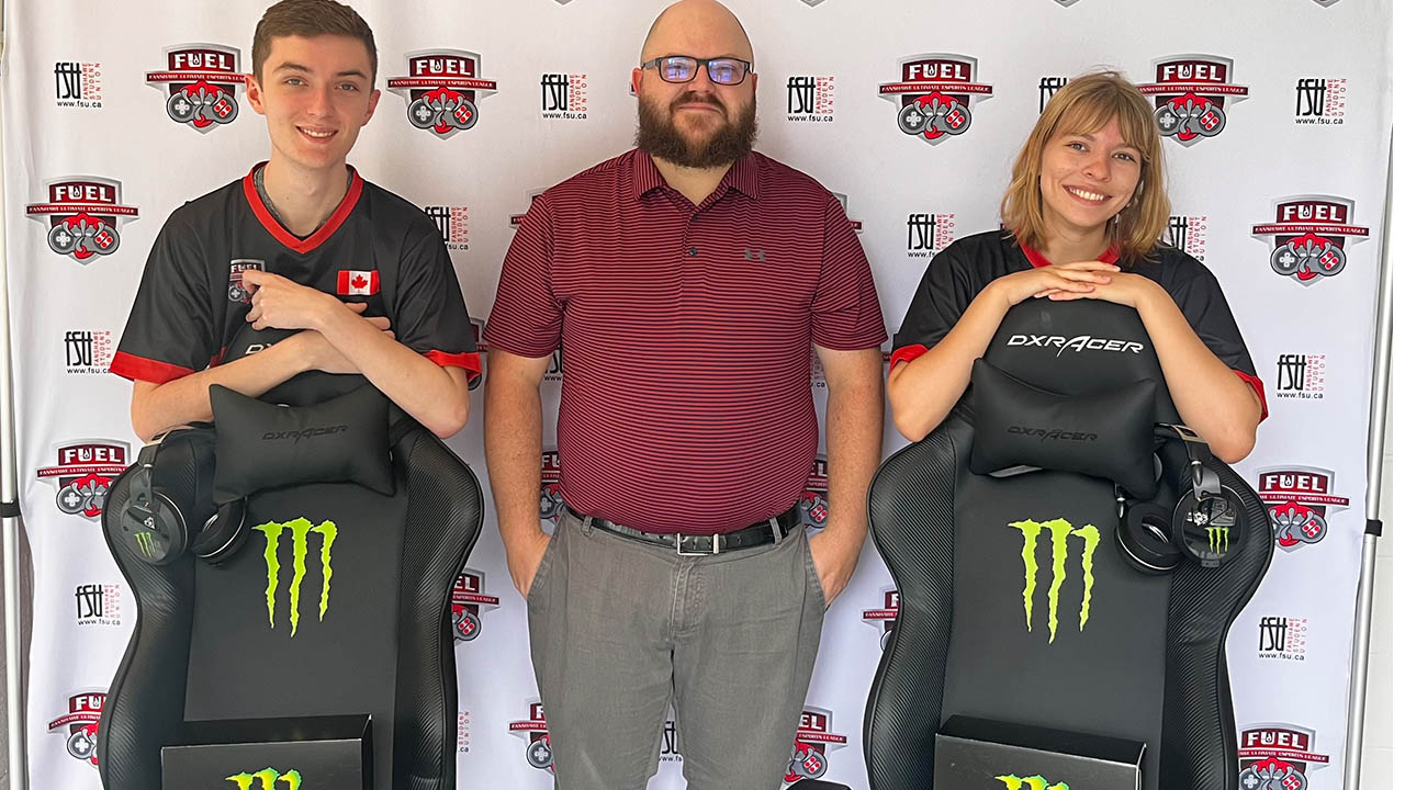 Adam Boyce (left), Tyler Hetherington (middle) and Veronica Visla (right) standing with the new prizes and gaming chairs from Monster.