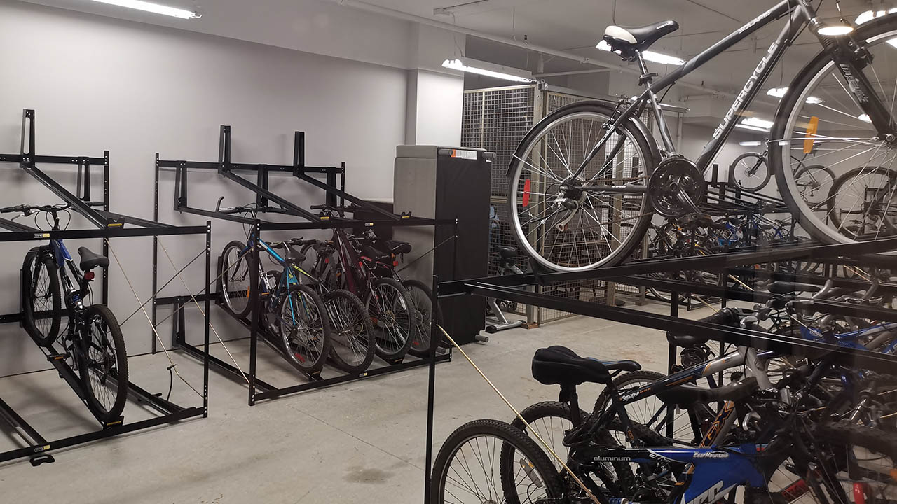 Several bikes in a storage area.