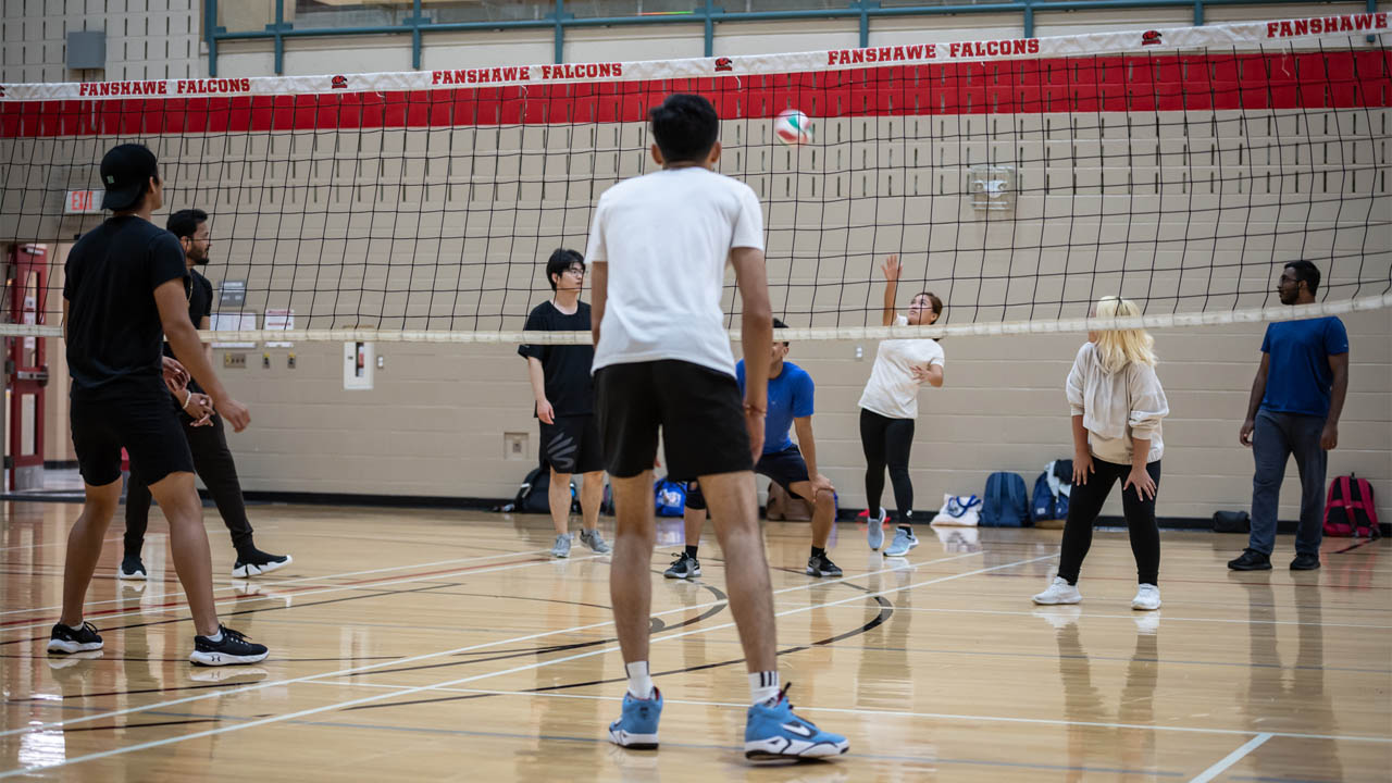Students play volleyball in the Fanshawe gym.