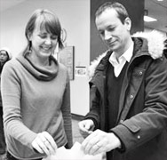 Staff casting a ballot