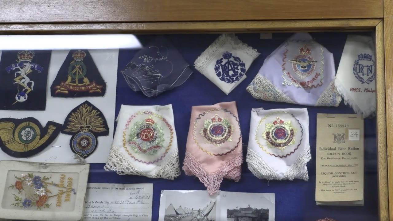 An image of handkerchiefs in a display cabinet.