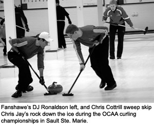 Fanshawe's DJ Ronaldson left, and Chris Cottrill sweep skip Chris Jay's rock down the ice during the OCAA curling championships in Sault Ste. Marie