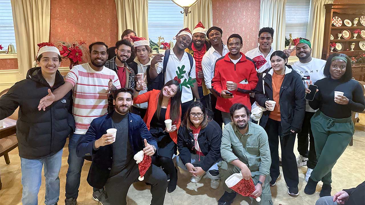 A photo of member of the Rotaract Club dressed in holiday attire.