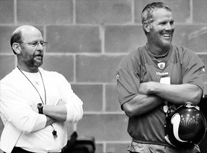 Will he or won't he play? That decision by Brett Favre, right, won't come soon, but Minnesota head coach Brad Childress is willing to wait for the answer.