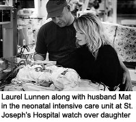 Laurel Lunnen along with husband Mat in the neonatal intensive care unit at St. Joseph's Hospital watch over daughter
