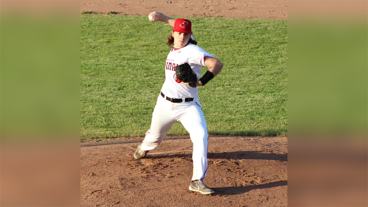 A photo of Falcon's pitcher Dusan Karich throwing a pitch midgame