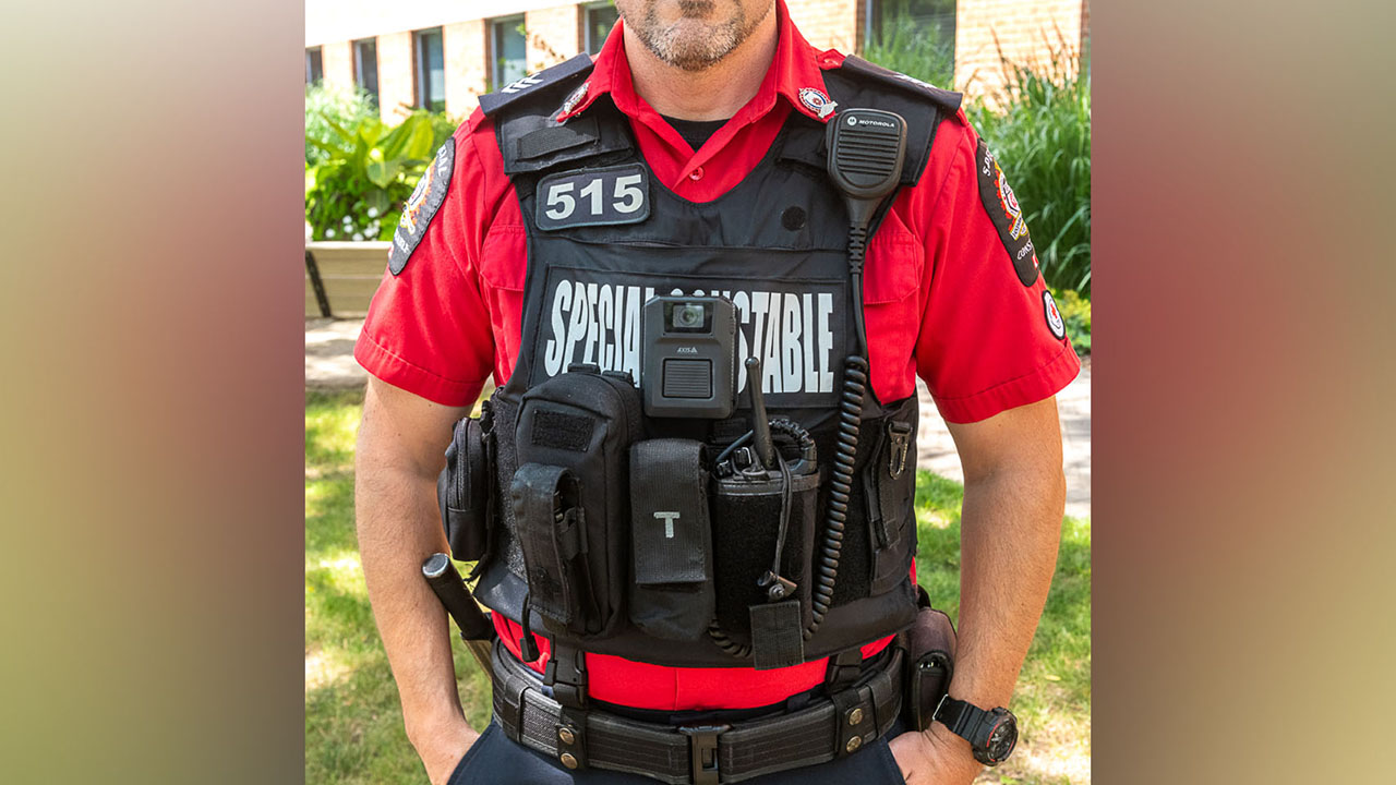 A photo of a Fanshawe security officer wearing a body camera on his uniform