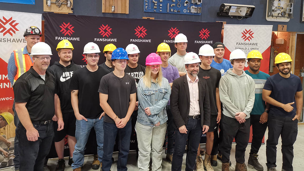 Minster Steven Guilbeault poses with students at Fanshawe College
