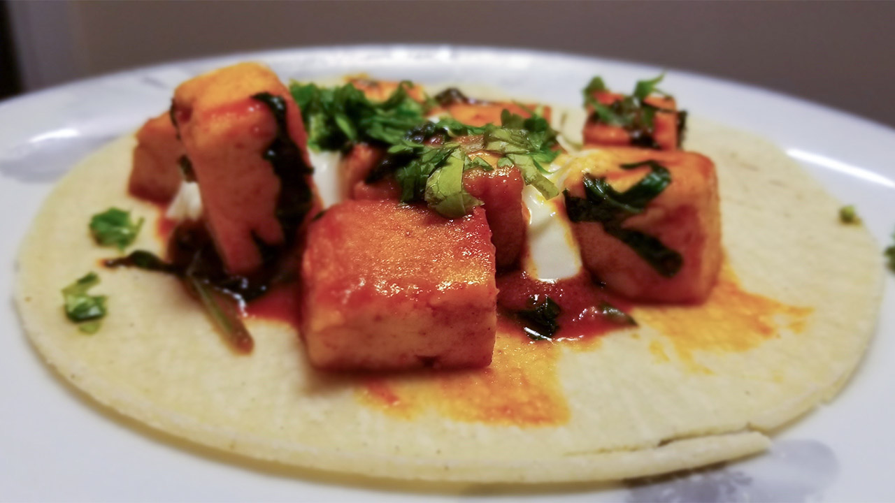 A photo of paneer with spices on a taco