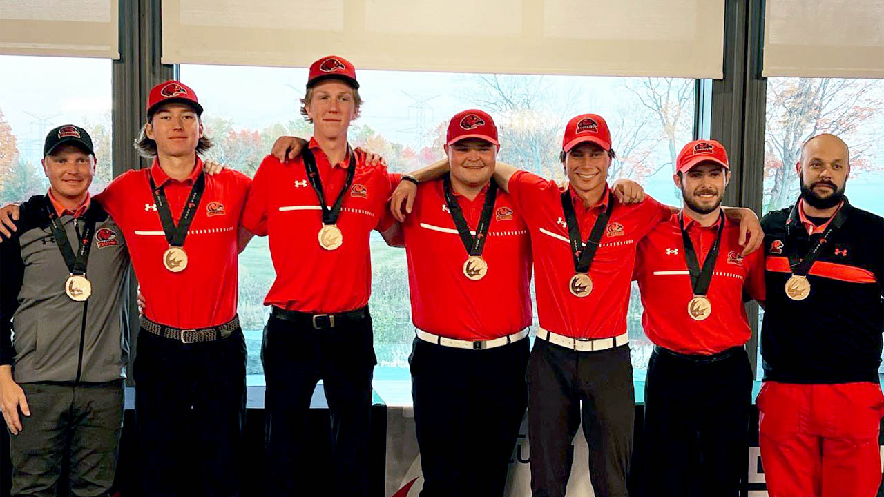 Members of the men's Fanshawe golf team wearing medals.