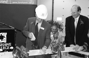 Fanshawe President Howard rundle cuts the ceremonial “ribbon” at the official opening of the new T-Building