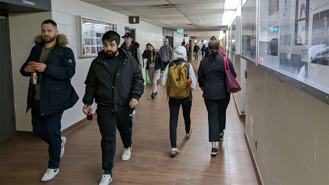 A photo showing students walking in the hallway of Fanshawe College.