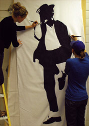 Students paint a familiar and famous silhouette for the Rock 'N' Runway Revolution show.