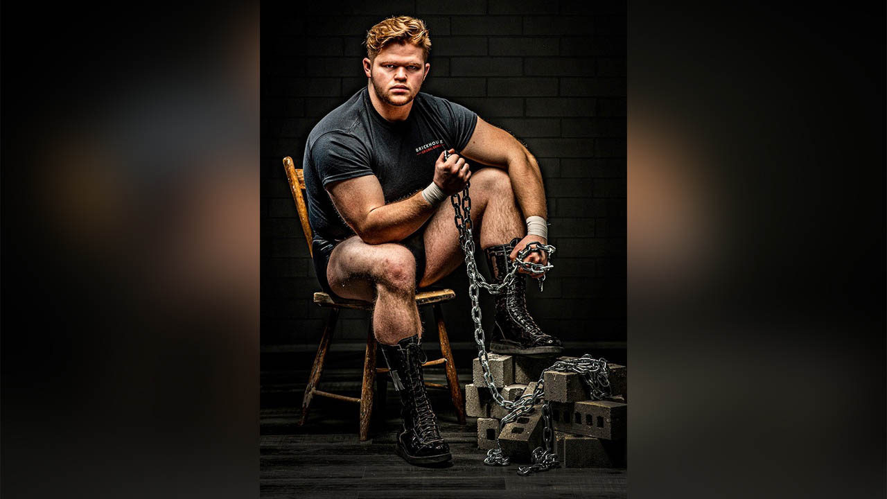 Colton Churchill poses with bricks and chains.